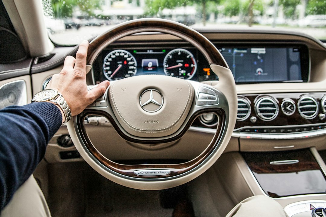person sitting in Mercedes Benz driver seat